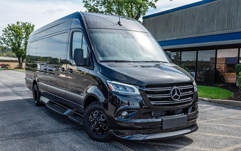 Black executive Sprinter-style passenger van, representative image